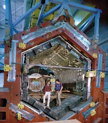 The Time Projection Chamber, shown with inventor David Nygren (left), was designated for use at the positron-electron colliding beam ring at Stanford.