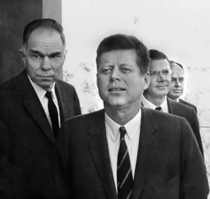 Kennedy with Seaborg (left) and McNamara (right) at the Lab.